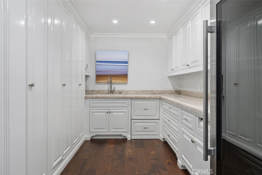 4 Inverness Lane Newport Beach, CA 92660 - Photo 20 of 56 a kitchen with white cabinets and sink