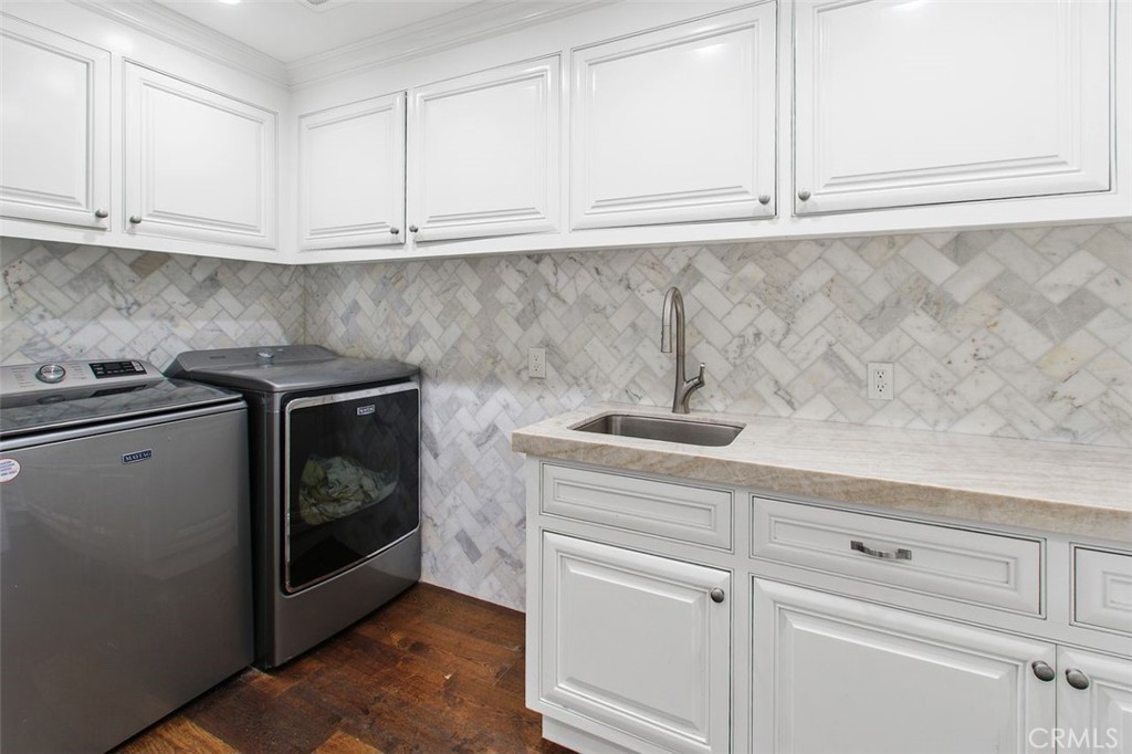 4 Inverness Lane Newport Beach, CA 92660 - Photo 21 of 56 a kitchen with white cabinets and white appliances