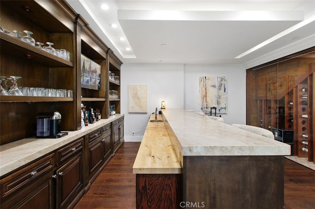 4 Inverness Lane Newport Beach, CA 92660 - Photo 22 of 56 a dining hall with stainless steel appliances kitchen island granite countertop a sink and cabinets