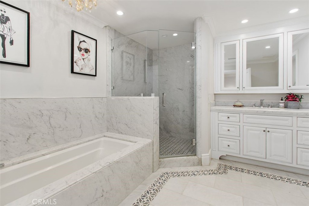 4 Inverness Lane Newport Beach, CA 92660 - Photo 28 of 56 a bathroom with a tub sink and mirror