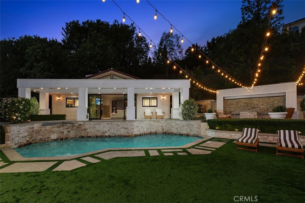 4 Inverness Lane Newport Beach, CA 92660 - Photo 3 of 56 a front view of a house with a garden and yard