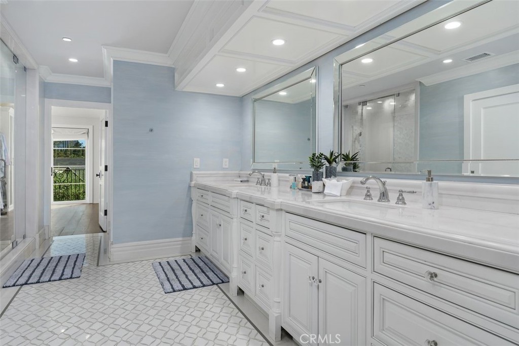 4 Inverness Lane Newport Beach, CA 92660 - Photo 35 of 56 a spacious bathroom with a double vanity sink a mirror and a bathtub