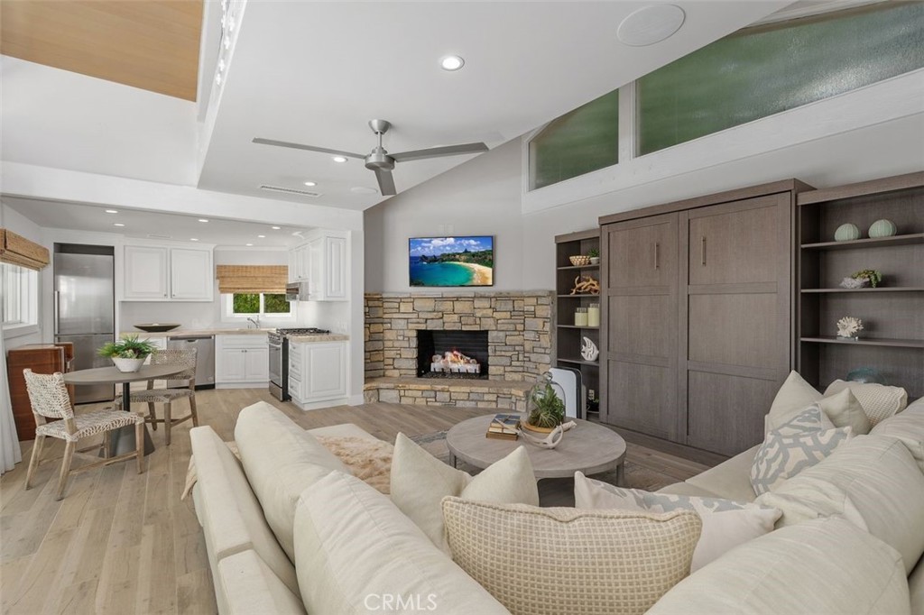 4 Inverness Lane Newport Beach, CA 92660 - Photo 46 of 56 a living room with furniture and a fireplace