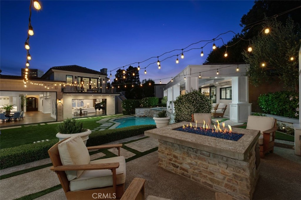 4 Inverness Lane Newport Beach, CA 92660 - Photo 51 of 56 a view of a house with patio entertaining space with furniture and garden