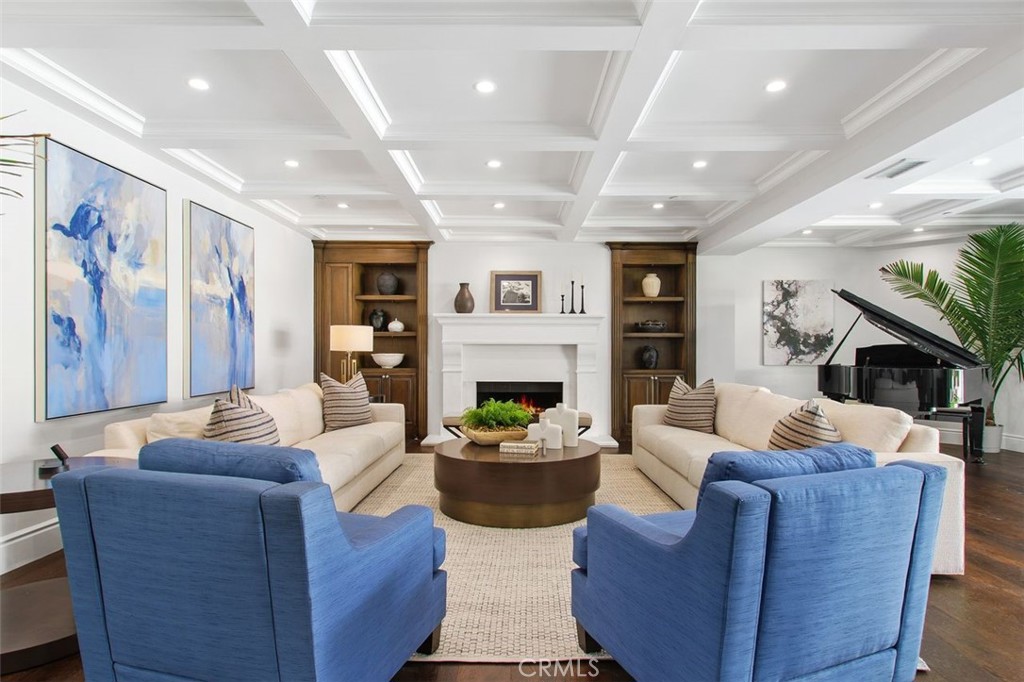 4 Inverness Lane Newport Beach, CA 92660 - Photo 9 of 56 a living room with fireplace furniture and a wooden floor