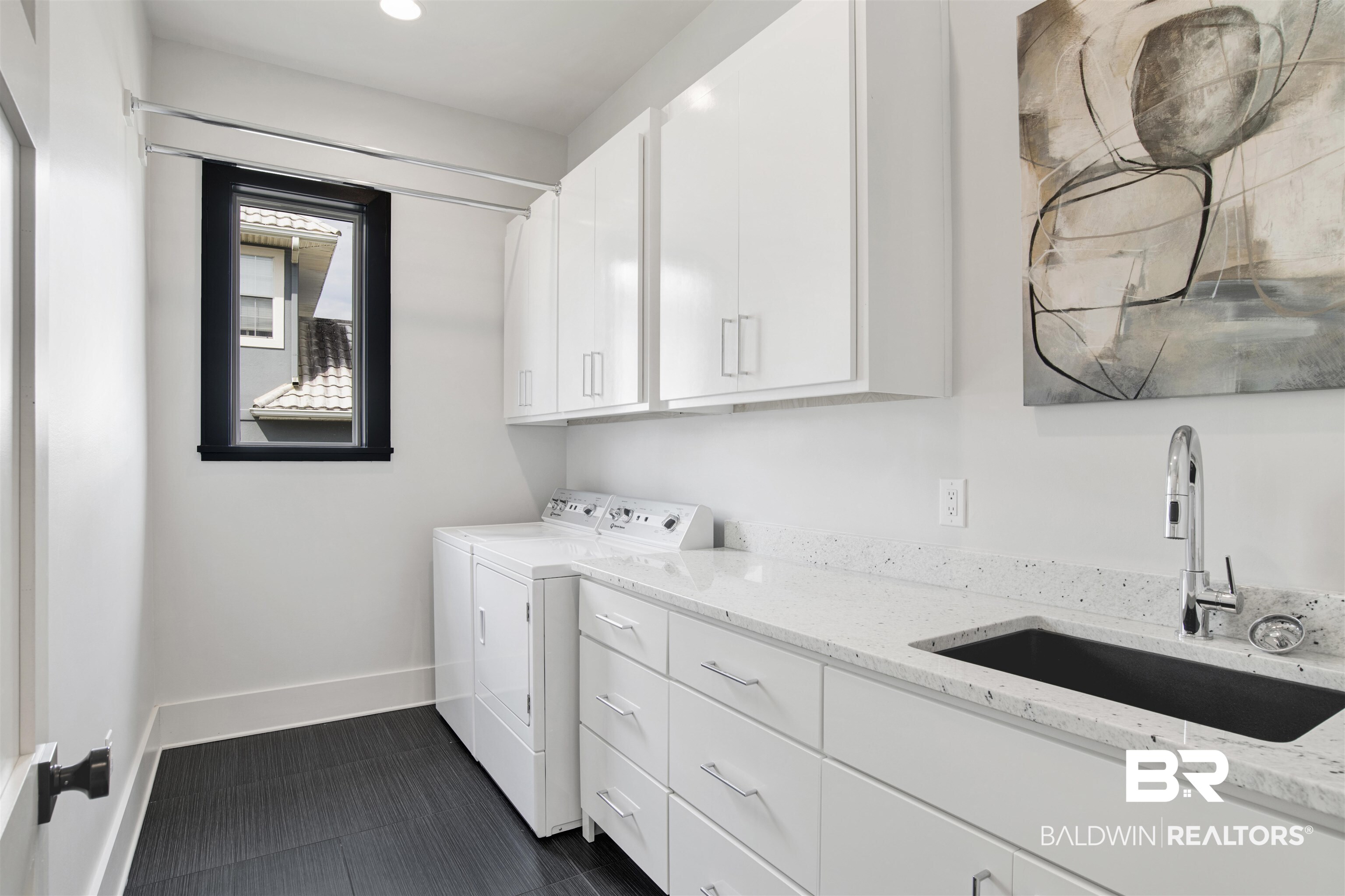 30239 Canal Court Orange Beach, AL 36561 - Photo 26 of 70 Laundry area featuring washer and clothes dryer and cabinet space