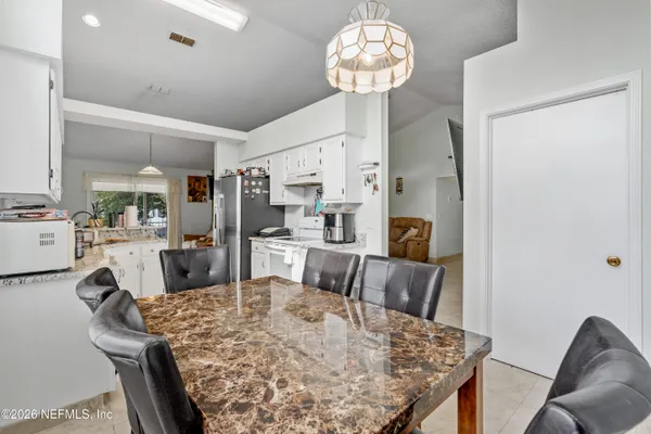 a view of a dining room with furniture