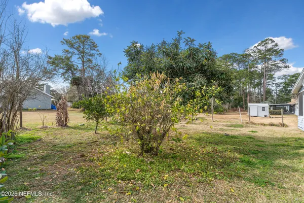 a backyard of a house with lots of green space