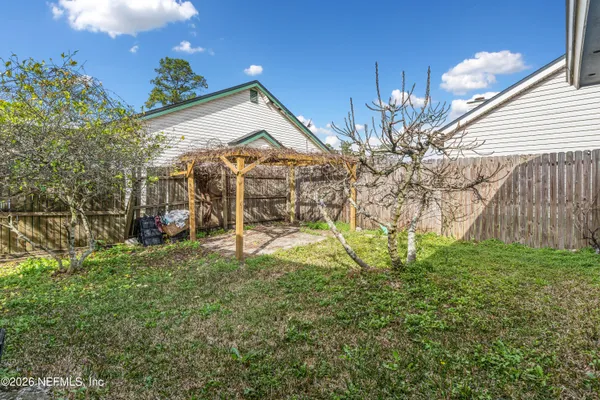 a view of a house with a back yard