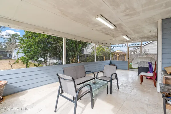 a view of a patio with chairs and tables