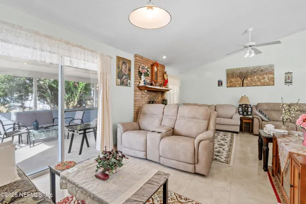 a living room with furniture and a large window