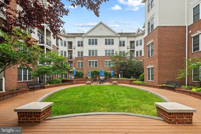 a front view of a building with garden
