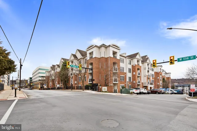 a view of a street with a building in the background