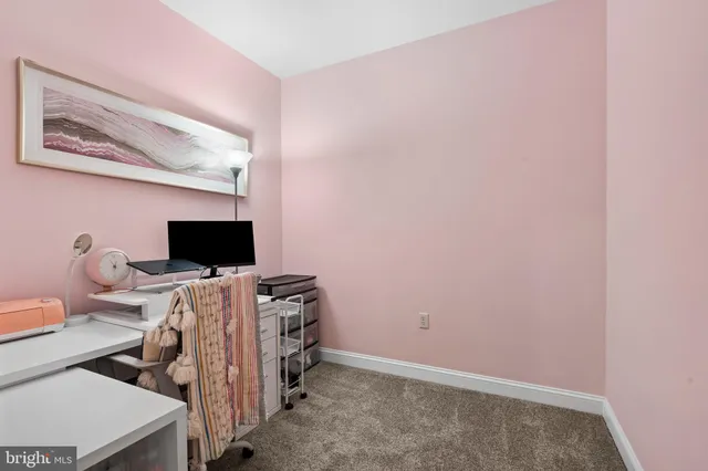 a view of a workspace with furniture