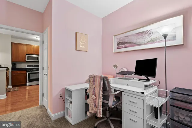 a view of a workspace with furniture