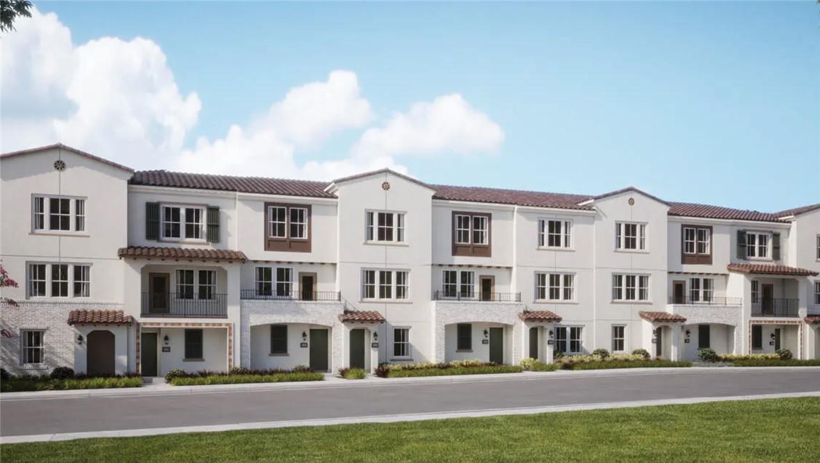 9829 La Serna Drive, Unit 5 Whittier, CA 90603 - Photo 6 of 9 a front view of residential houses with yard and cars