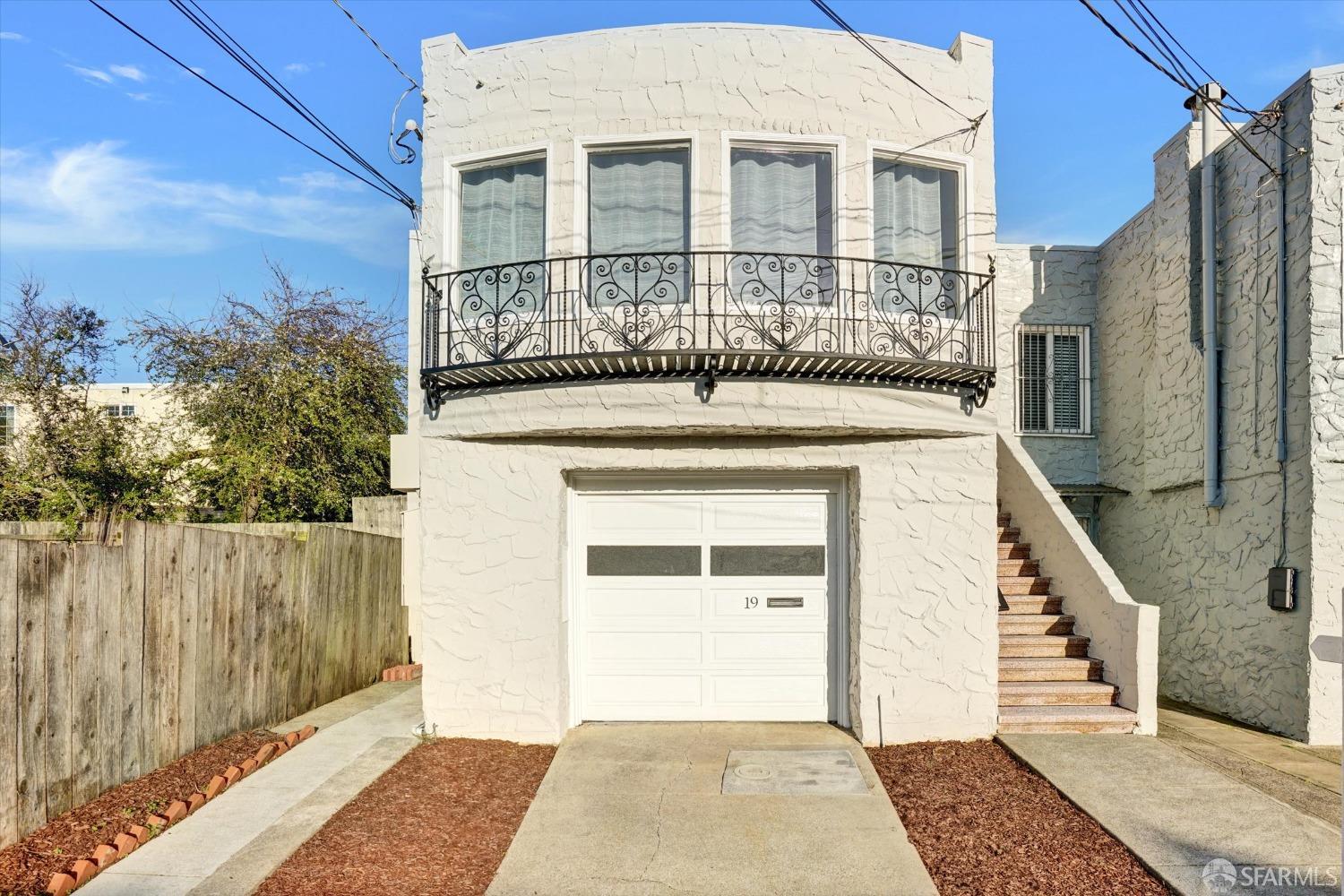 a view of a brick house with a large window