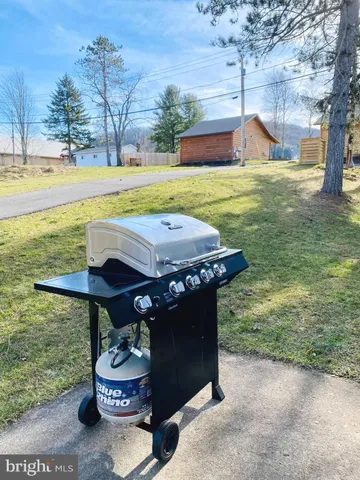 a view of a house with snow in the yard