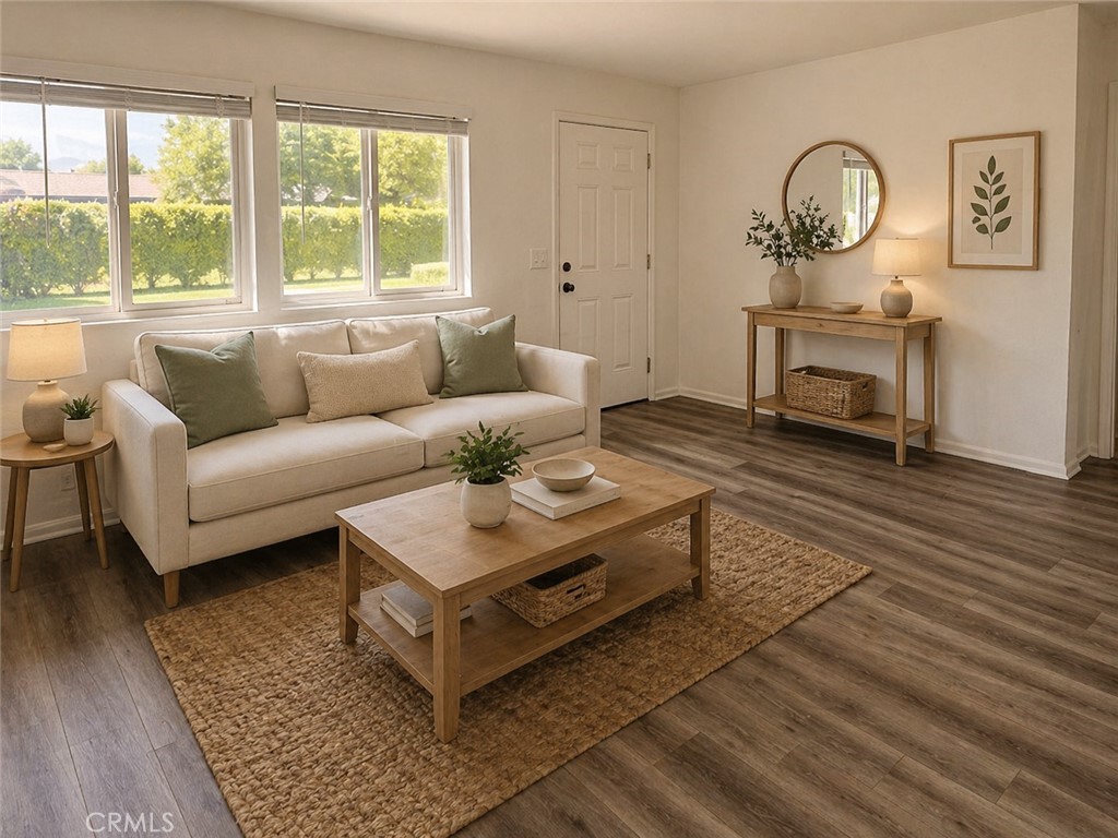 73740 Santa Rosa Way, Unit E Palm Desert, CA 92260 - Photo 1 of 15 a living room with furniture a window and a chandelier