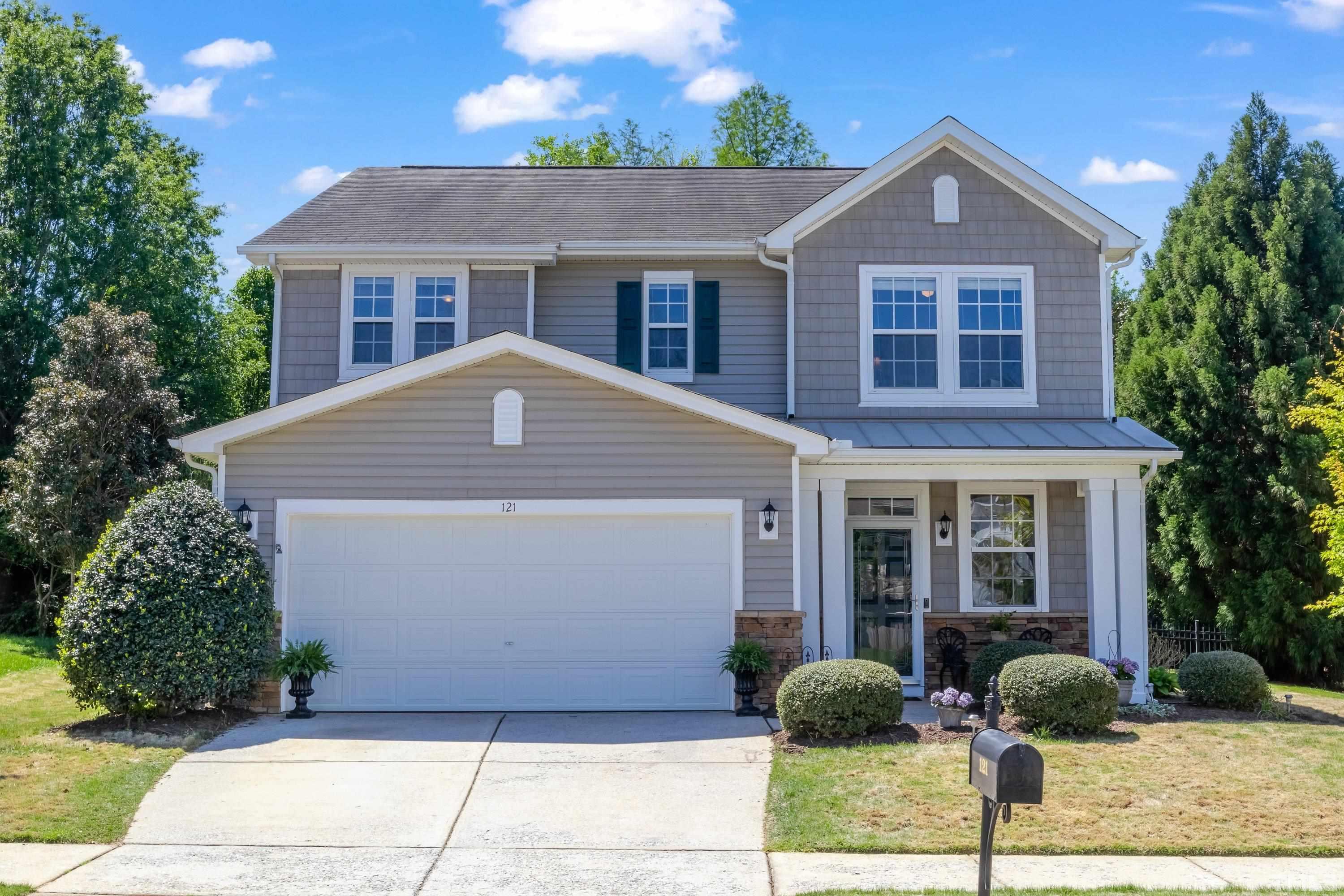 121 Ryder Cup Circle Raleigh, NC 27603 - Photo 1 of 43 a front view of a house with garden