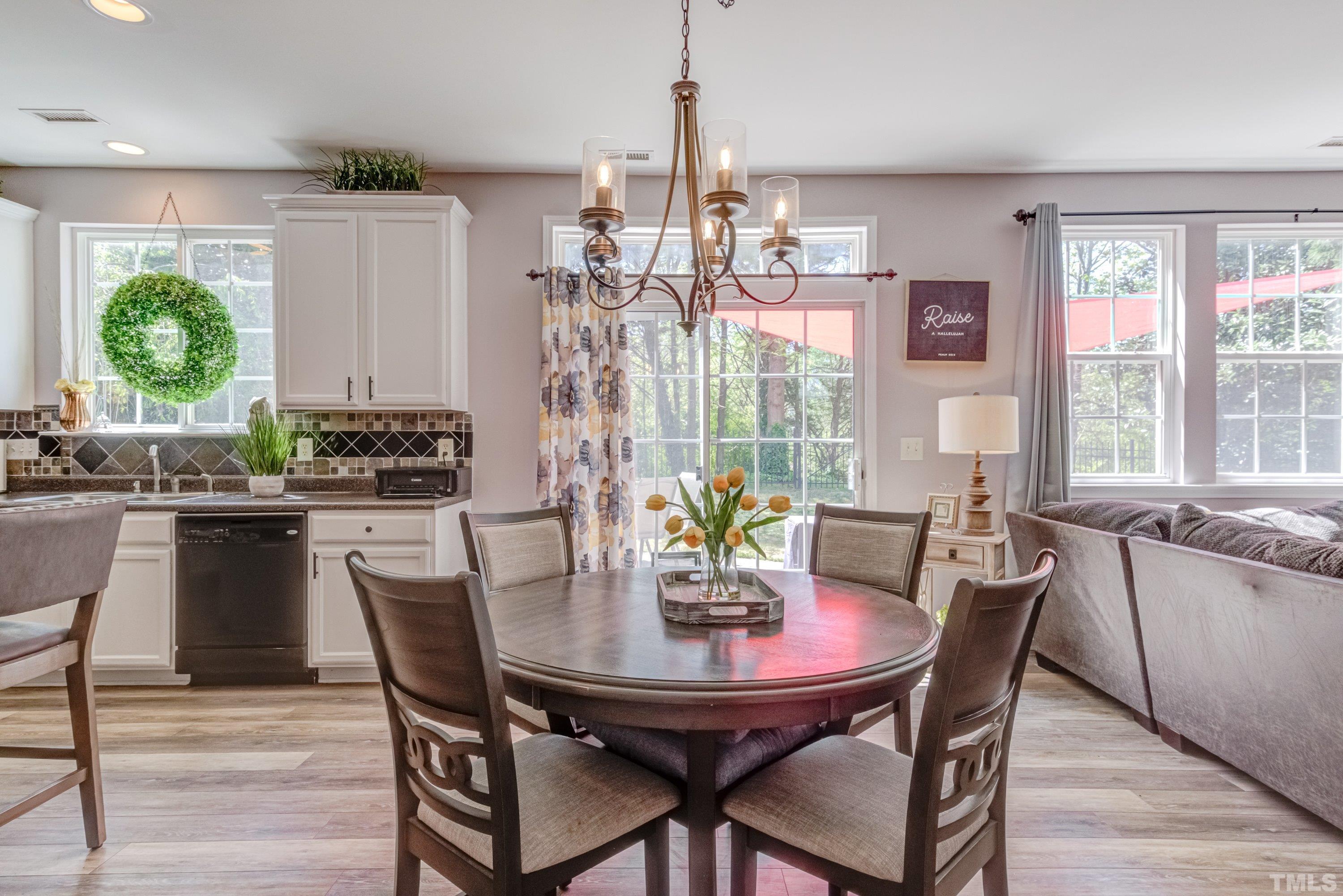 121 Ryder Cup Circle Raleigh, NC 27603 - Photo 12 of 43 a view of a dining room with furniture and window