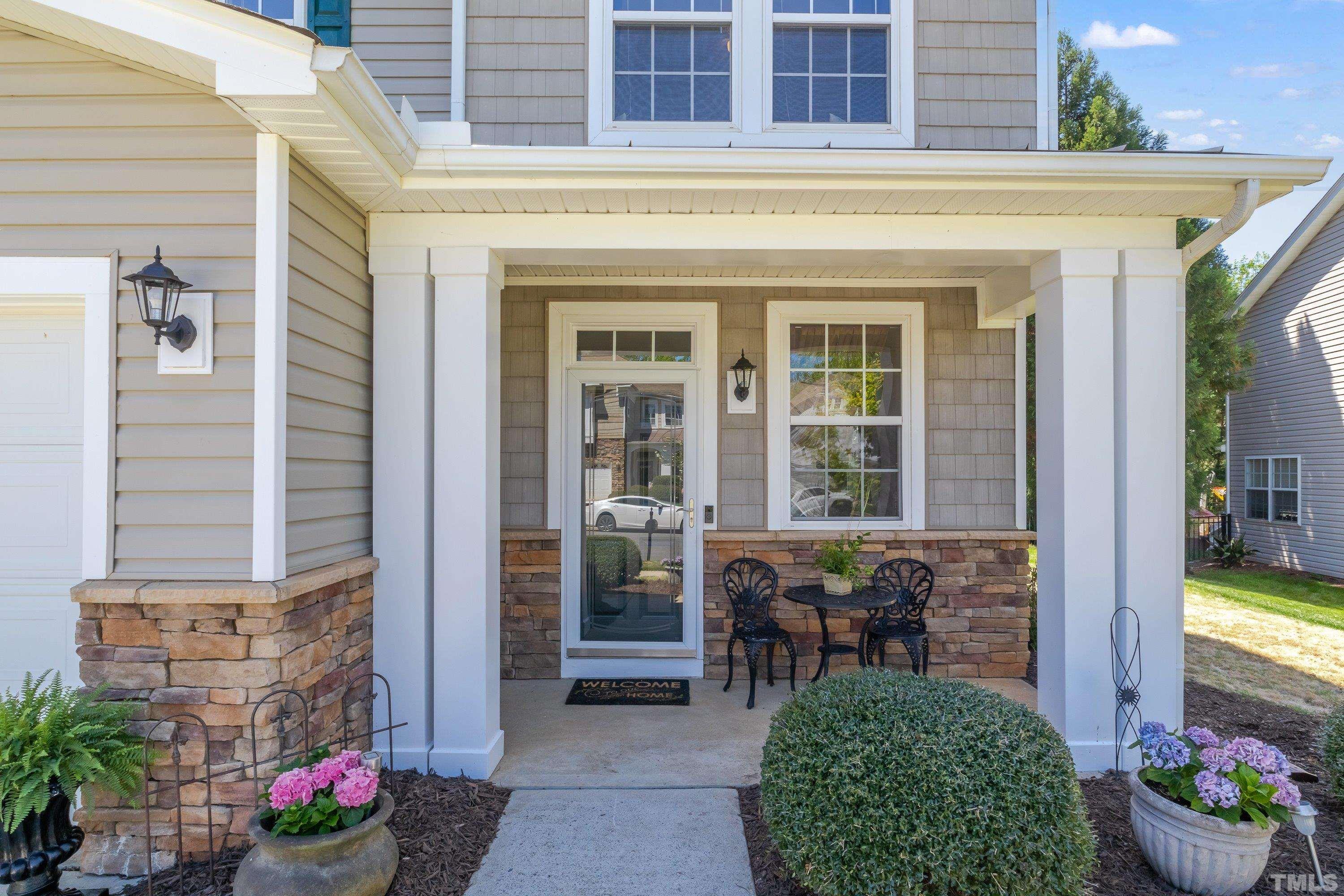 121 Ryder Cup Circle Raleigh, NC 27603 - Photo 2 of 43 a front view of a house with outdoor seating
