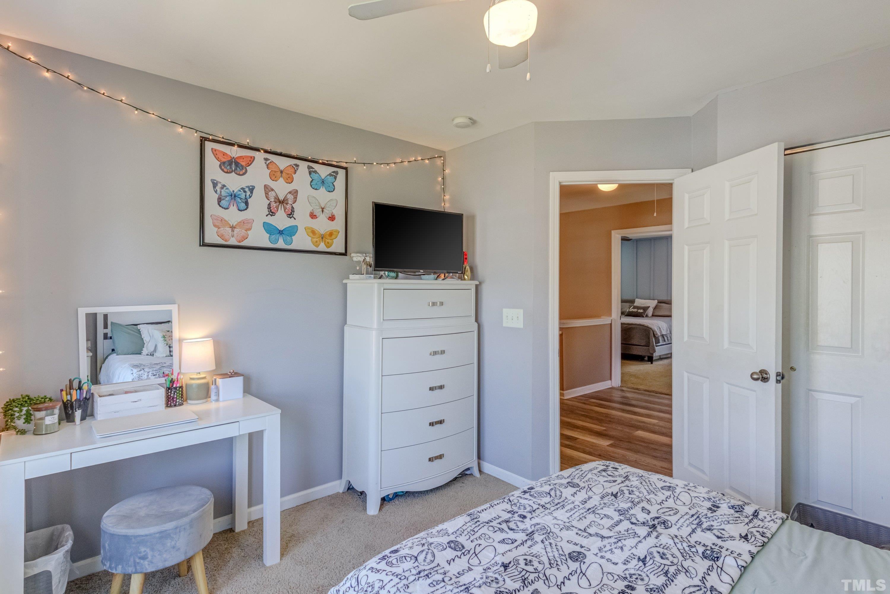 121 Ryder Cup Circle Raleigh, NC 27603 - Photo 29 of 43 a view of a livingroom with furniture and a flat screen tv