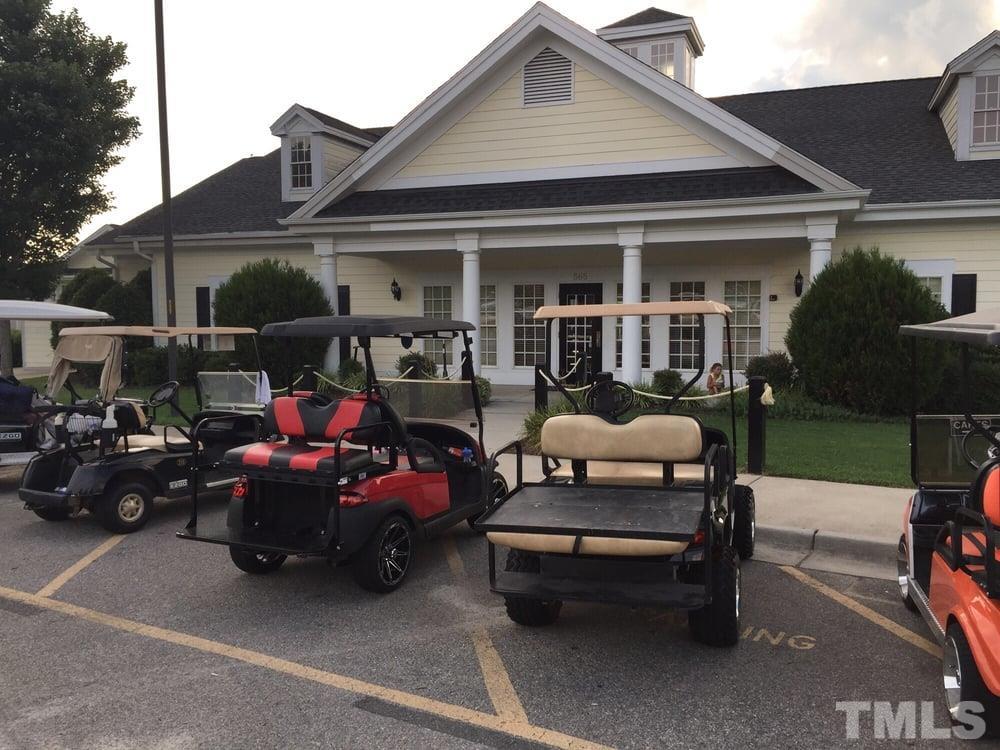 121 Ryder Cup Circle Raleigh, NC 27603 - Photo 43 of 43 a view of a patio with table and chairs and potted plants