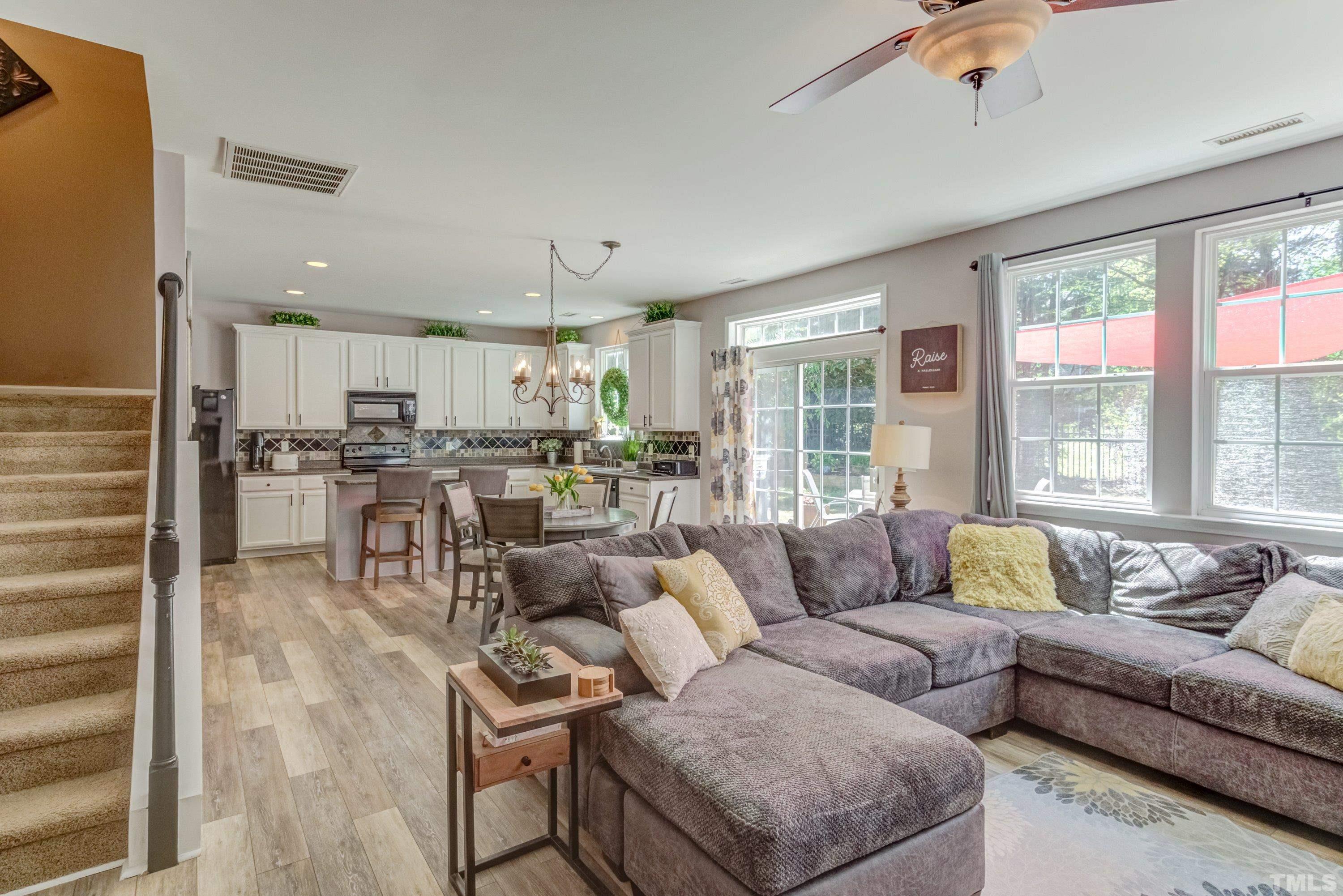 121 Ryder Cup Circle Raleigh, NC 27603 - Photo 10 of 43 a living room with furniture and a large window