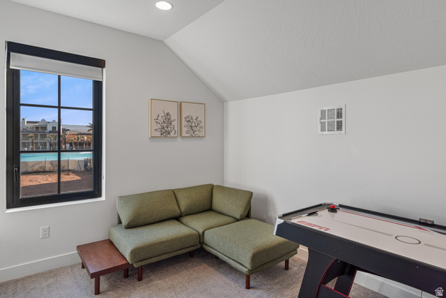 5367 Cyan Lane St. George, UT 84790 - Photo 9 of 49 Interior room featuring a large black-framed window with grid panes, recessed lighting, and an angled ceiling line