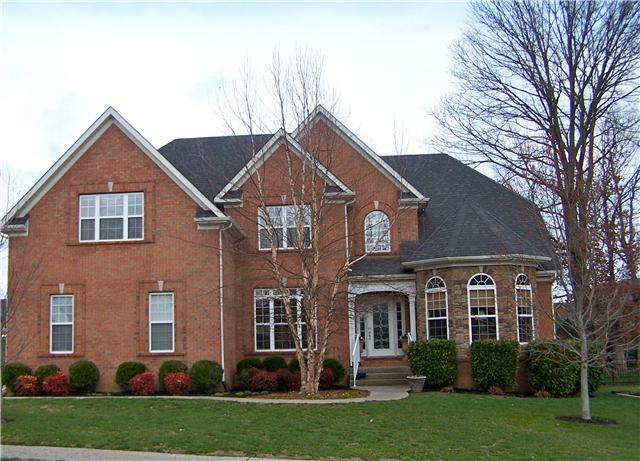 1224 White Rock Road Spring Hill, TN 37174 - Photo 1 of 15 a front view of a house with a yard and trees