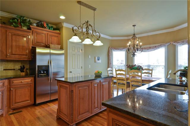 1224 White Rock Road Spring Hill, TN 37174 - Photo 3 of 15 a kitchen with counter top space cabinets and appliances