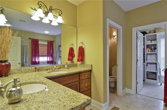 1224 White Rock Road Spring Hill, TN 37174 - Photo 5 of 15 a bathroom with a granite countertop sink and a mirror