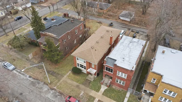 an aerial view of a house with a yard