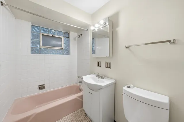 a bathroom with a sink toilet and bathtub