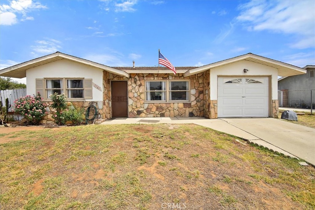 5781 Bee Jay Street Riverside, CA 92503 - Photo 1 of 1 a front view of a house with a yard