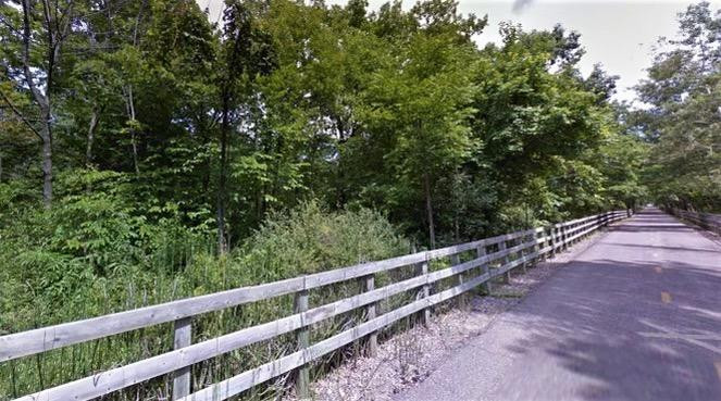 0 North Of Rr E Of Liverpool Road Hobart, IN 46342 - Photo 14 of 18 a view of a yard with wooden fence