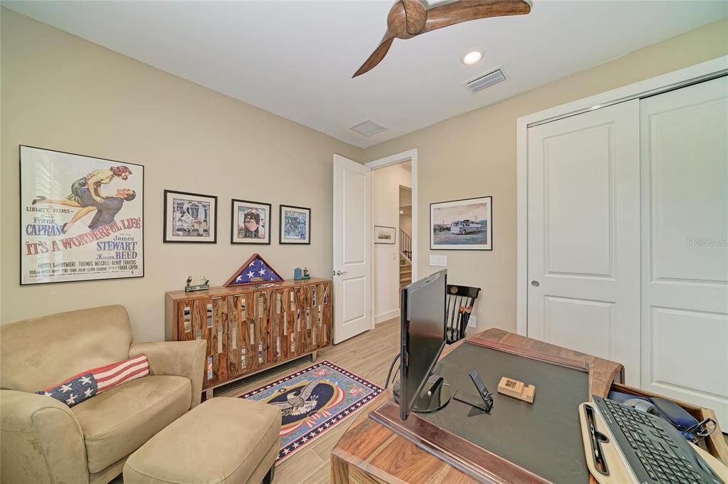 16341 Hidden Oak Loop Lakewood Ranch, FL 34211 - Photo 39 of 76 a living room with furniture and a window