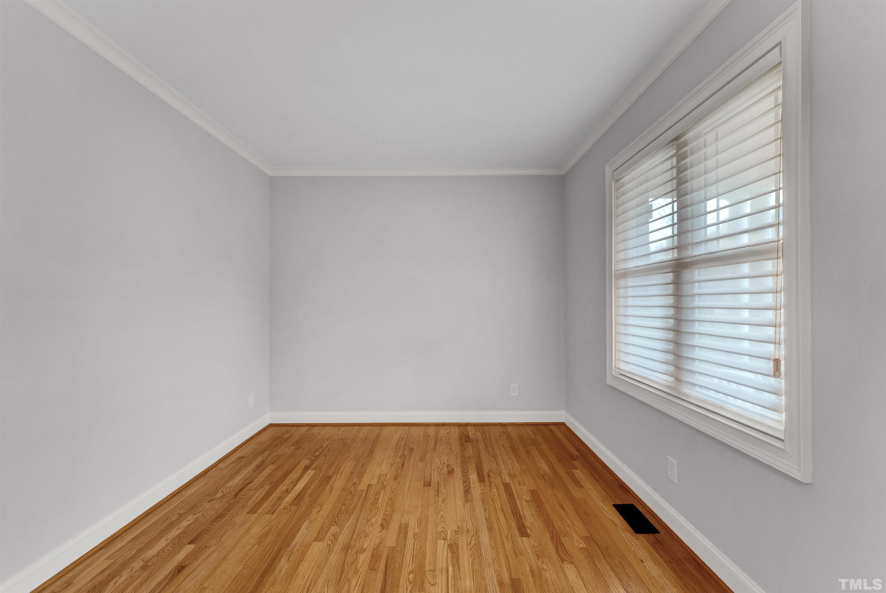 1201 Town Side Drive Apex, NC 27502 - Photo 15 of 40 wooden floor in an empty room with a window