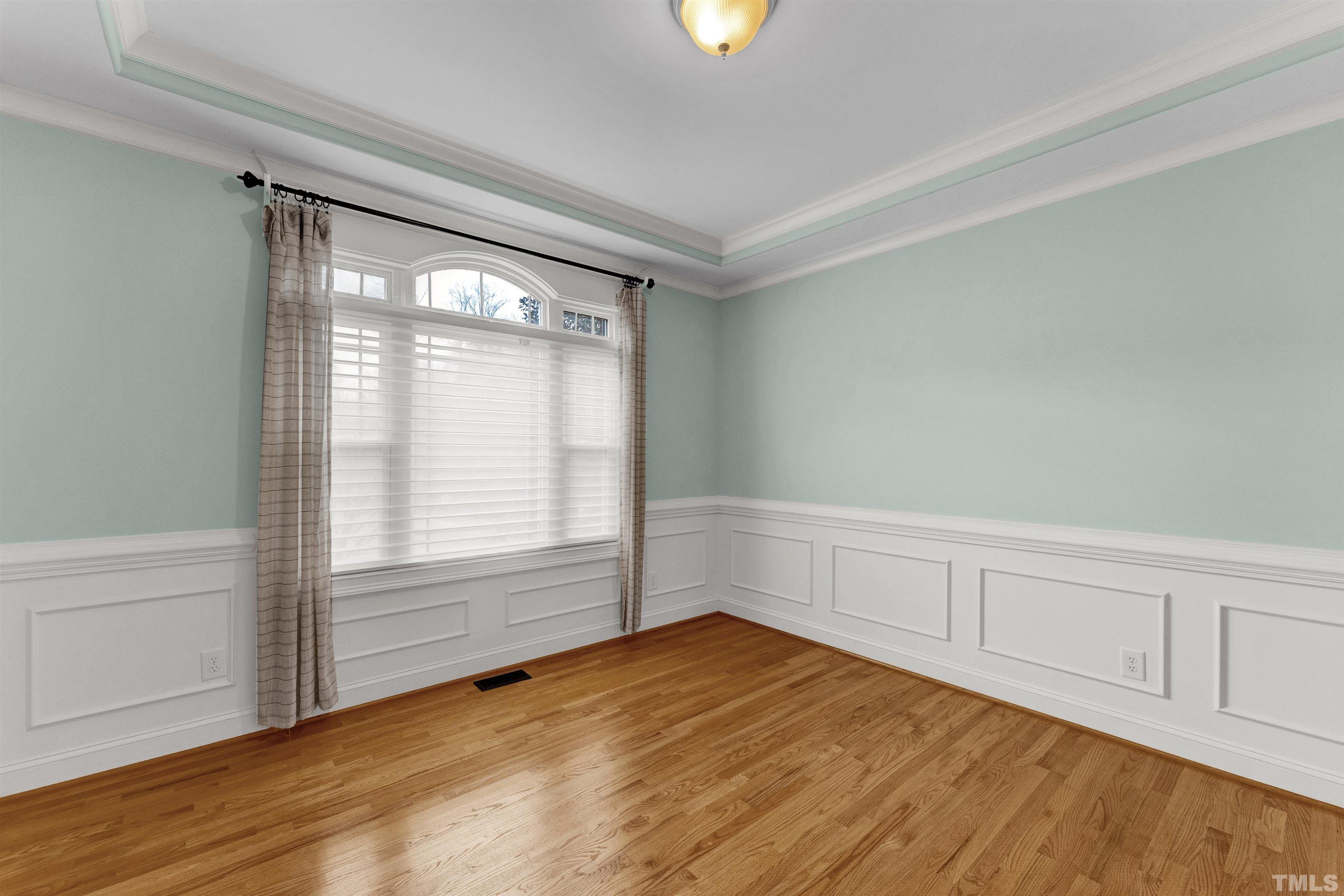 1201 Town Side Drive Apex, NC 27502 - Photo 17 of 40 a view of an empty room with wooden floor and a window