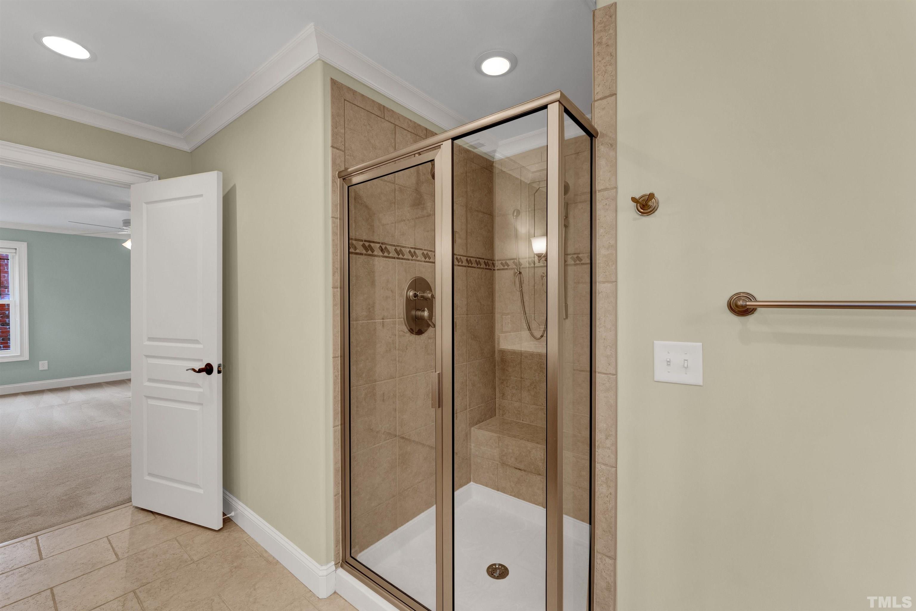 1201 Town Side Drive Apex, NC 27502 - Photo 26 of 40 a bathroom with a glass shower door