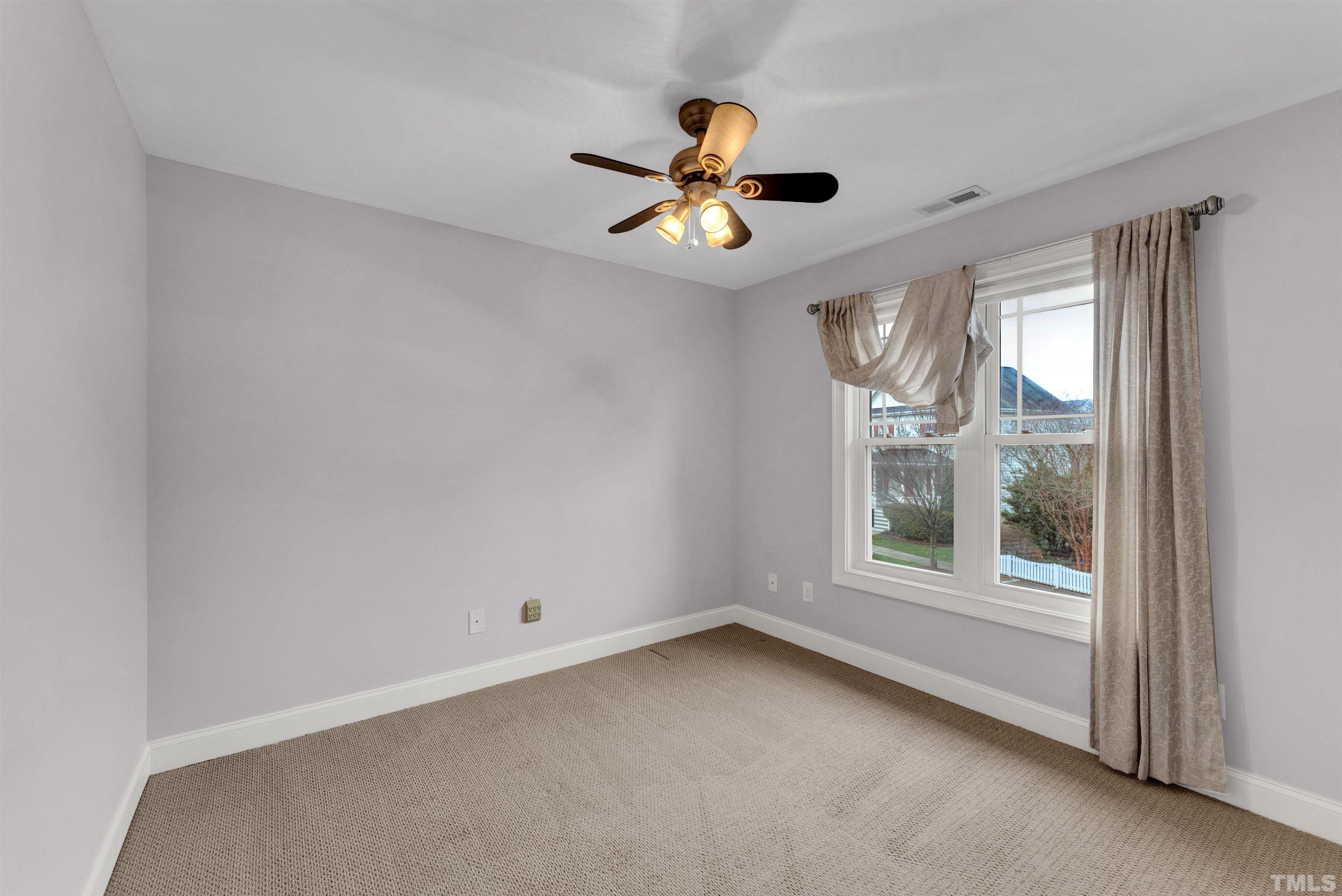 1201 Town Side Drive Apex, NC 27502 - Photo 32 of 40 a view of an empty room with a window