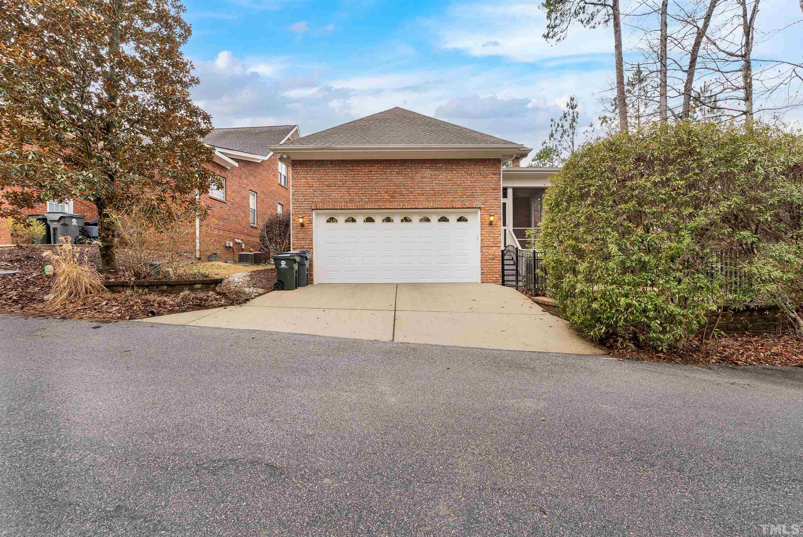 1201 Town Side Drive Apex, NC 27502 - Photo 36 of 40 a front view of a house with a yard and garage