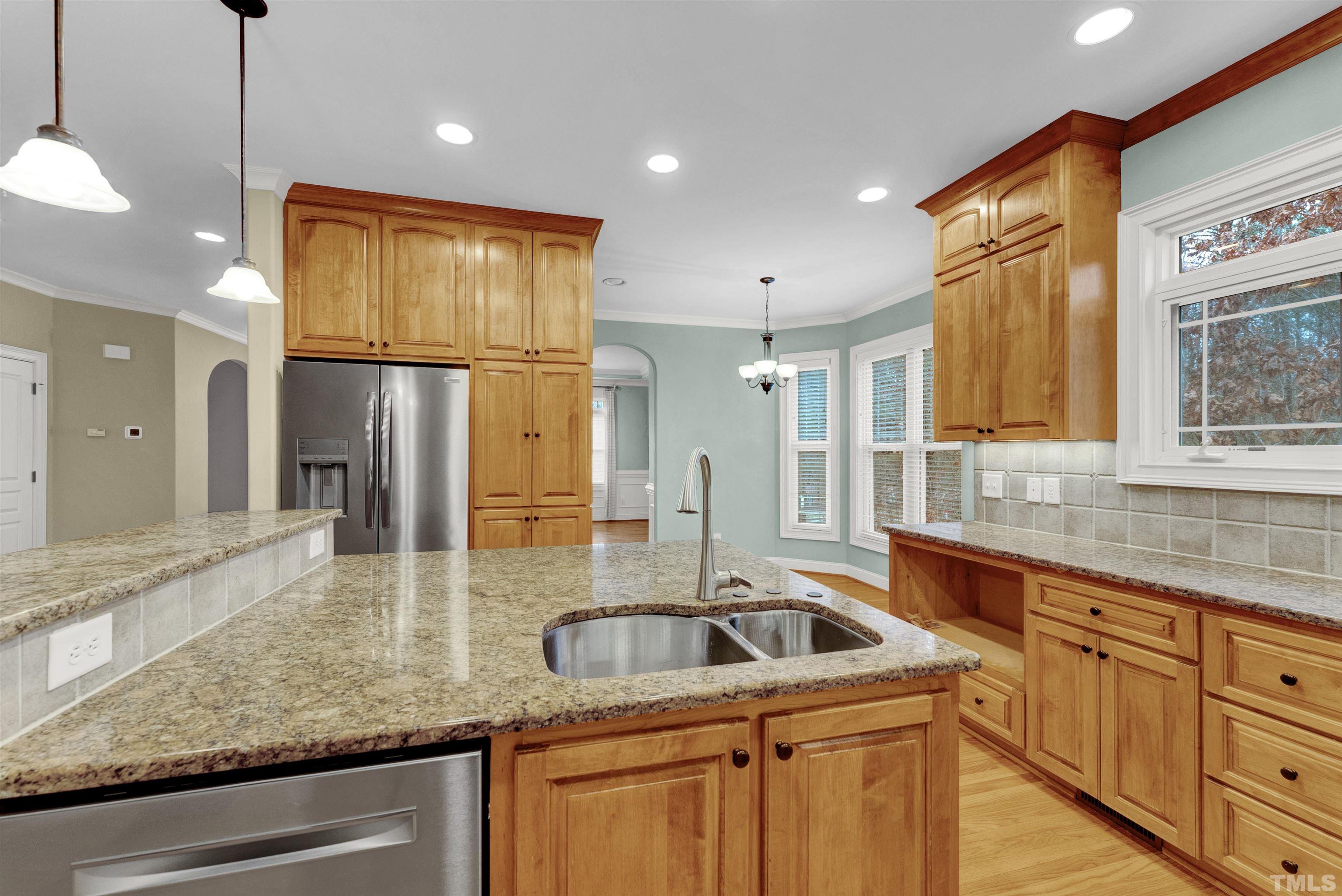 1201 Town Side Drive Apex, NC 27502 - Photo 7 of 40 a kitchen with sink cabinets and refrigerator