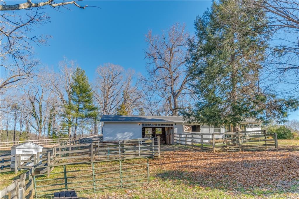 5975 Hunting Country Road Tryon, NC 28782 - Photo 14 of 47 a view of a house with a yard