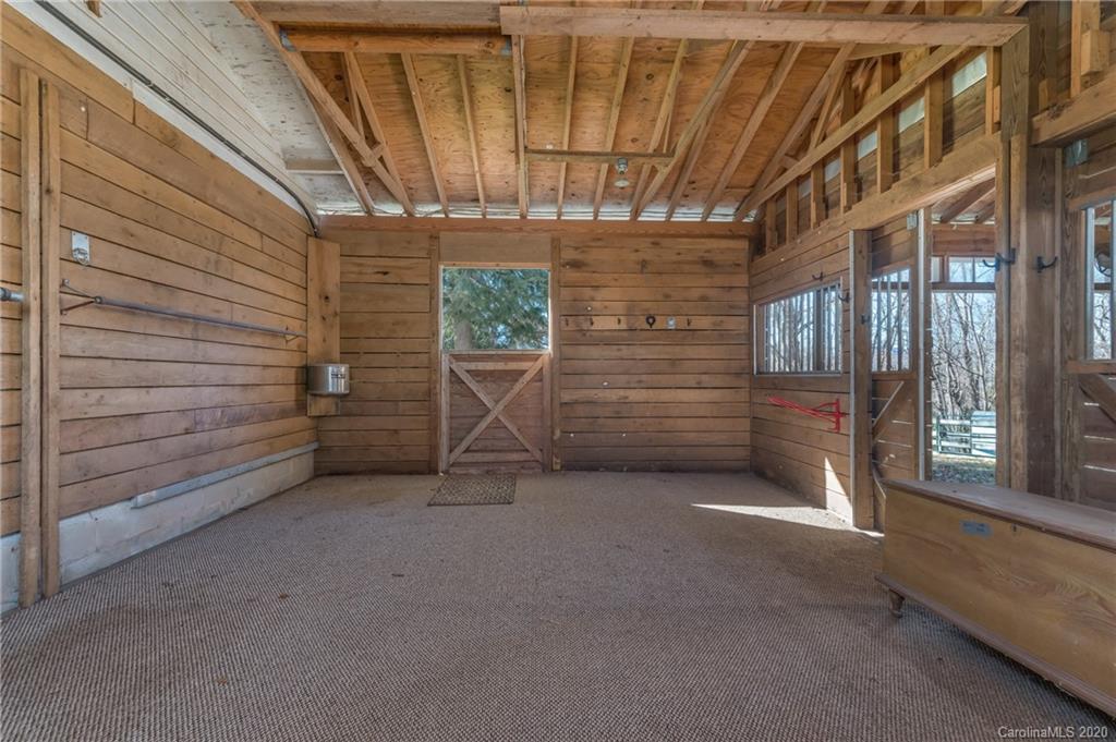 5975 Hunting Country Road Tryon, NC 28782 - Photo 20 of 47 a view of an empty room with windows