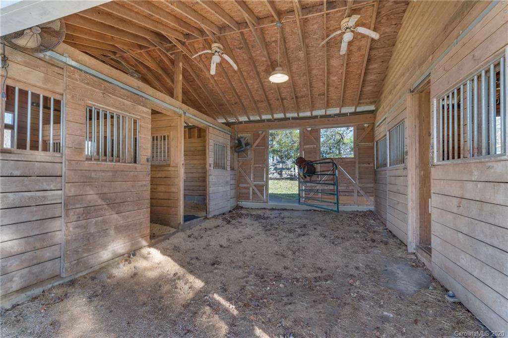 5975 Hunting Country Road Tryon, NC 28782 - Photo 3 of 47 a view of a porch with furniture