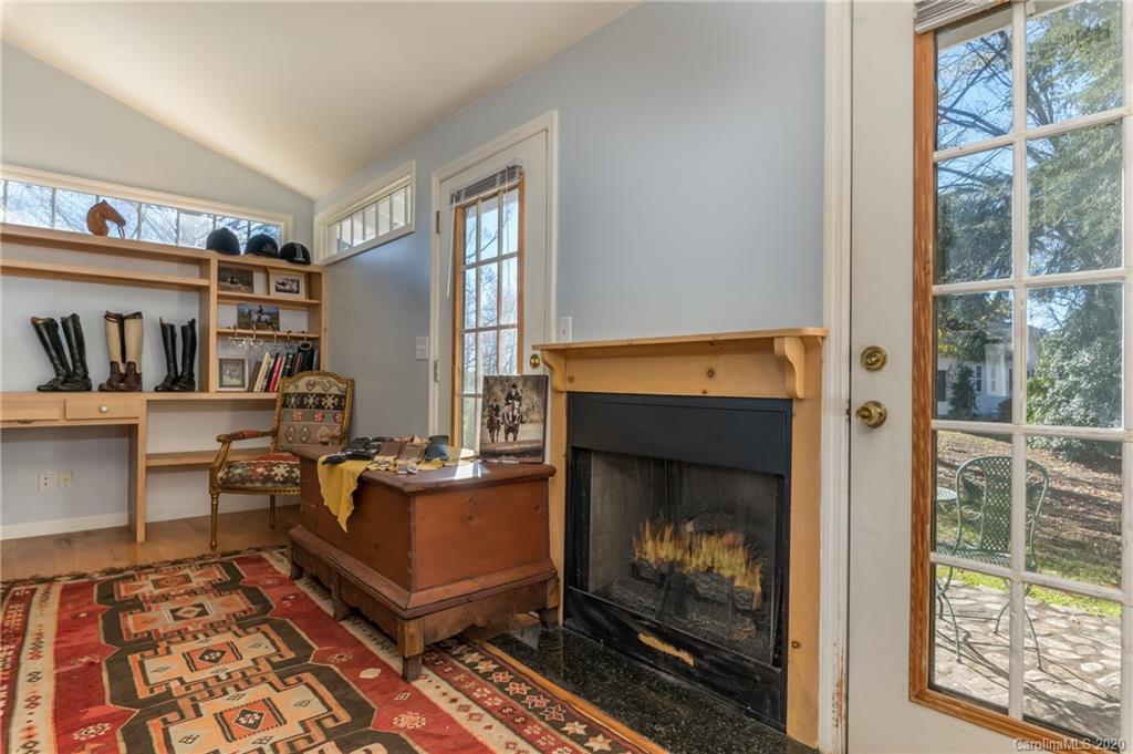 5975 Hunting Country Road Tryon, NC 28782 - Photo 23 of 47 a living room with furniture a window and a fireplace