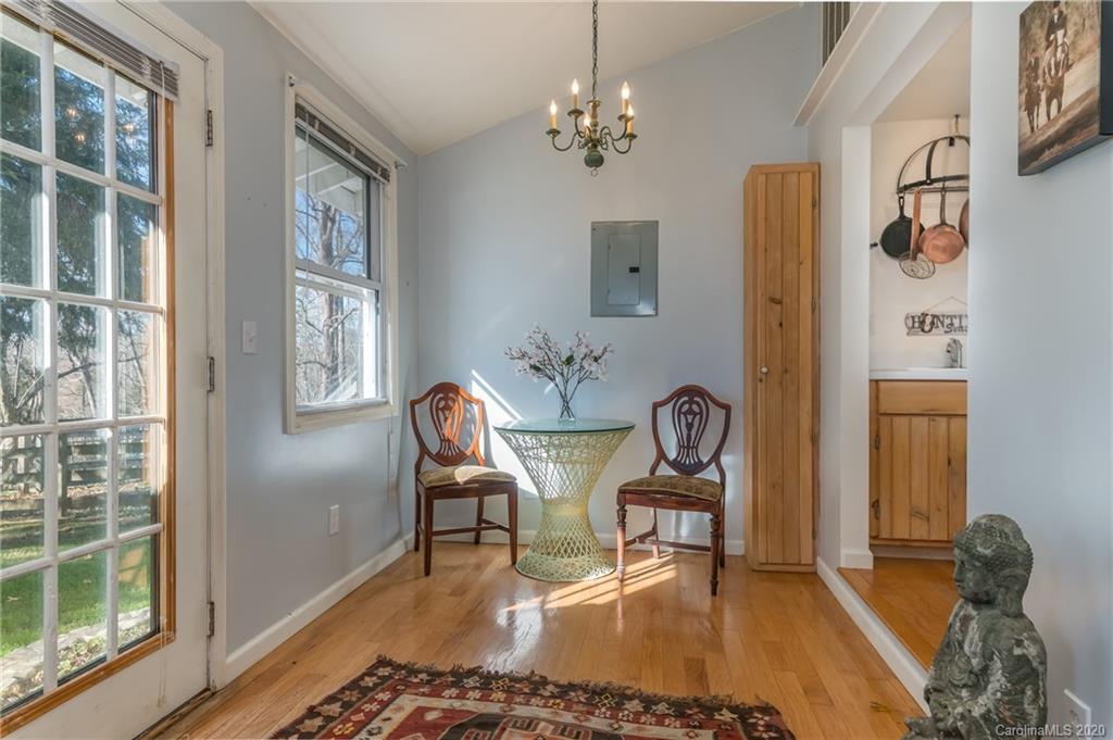 5975 Hunting Country Road Tryon, NC 28782 - Photo 24 of 47 a dining room with furniture and window
