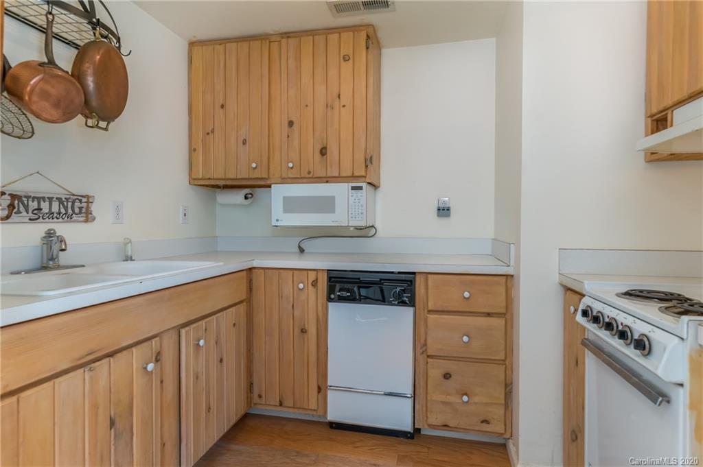 5975 Hunting Country Road Tryon, NC 28782 - Photo 25 of 47 a kitchen with appliances cabinets and a sink